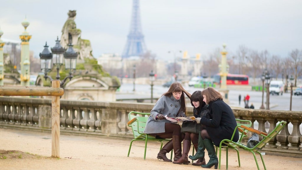access-to-france-for-foreigners-3-ladies-looking-at-map