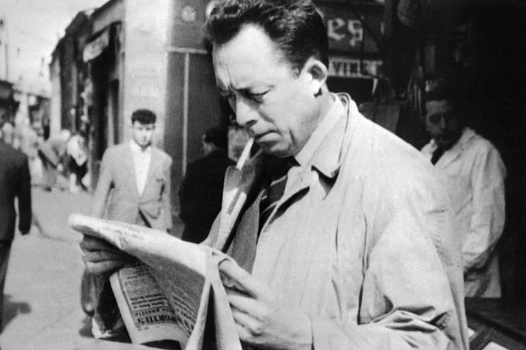 the-autor-of-the-plague-reading-news-paper